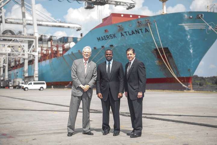GPA board chairman Robert Jepson, Atlanta mayor Kasim Reed, and GPA's Executive Director Curtis Foltz in front of Maersk vessel Atlanta, Monday at the Georgia Ports Authority's Garden City Terminal. The officials gathered just before Vice President Joe Biden shared remarks at the port of Savannah. (GPA Photo/Luke Smith)